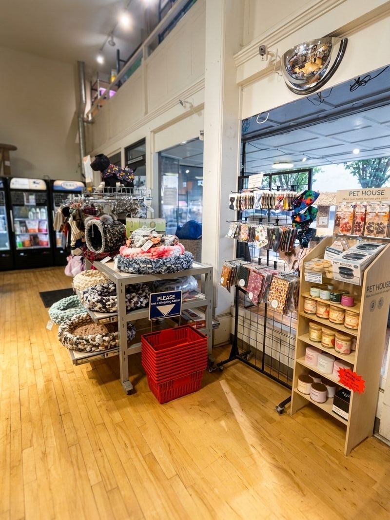 Pet beds, blankets and home accessories on display tables