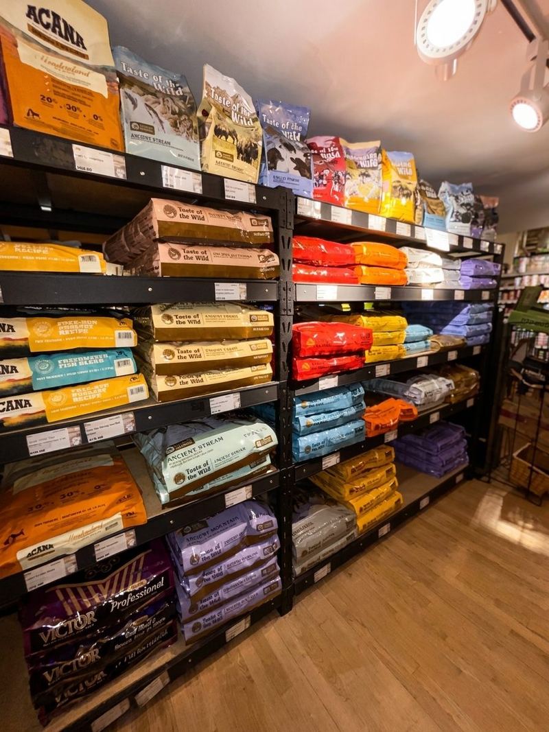 Shelves of Acana, Orijen and other dry dog food bags